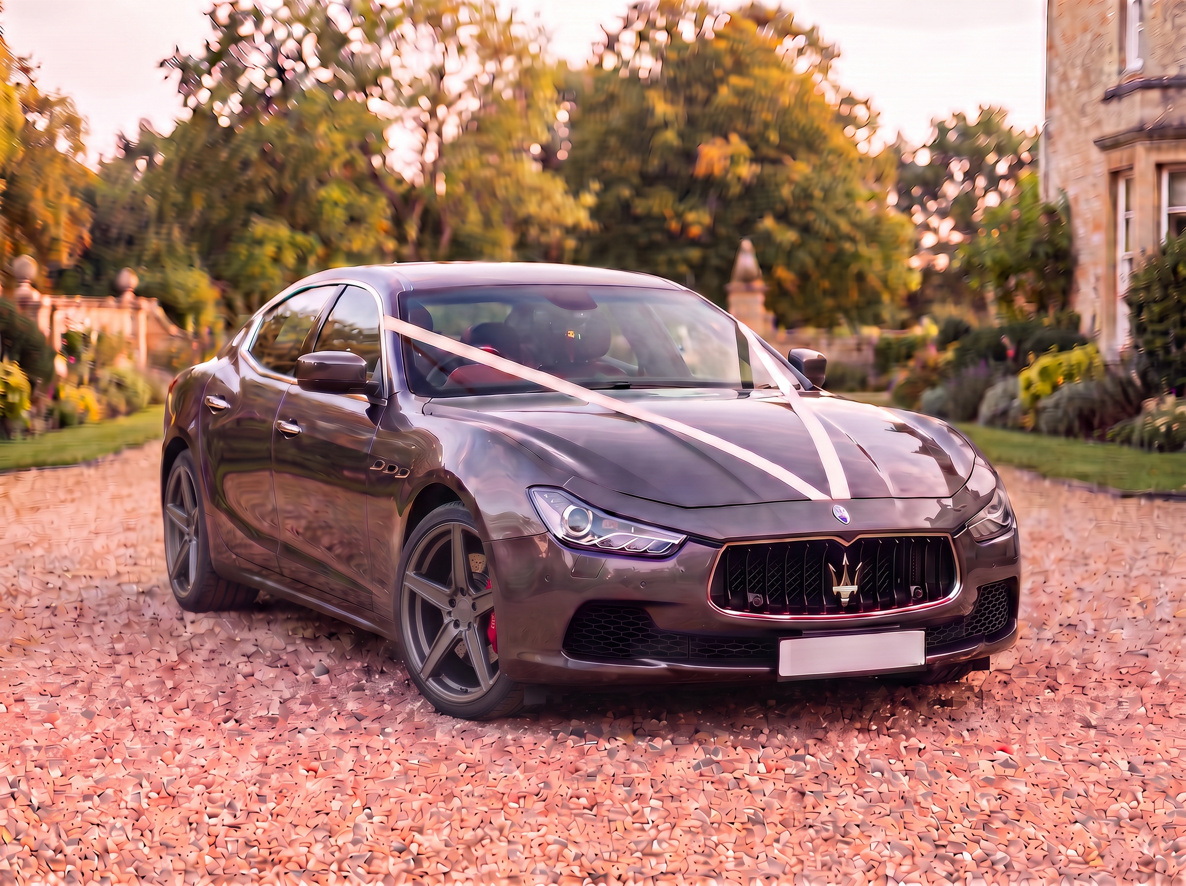 Front three-quarter view with wedding ribbons